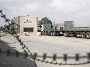 A truck is seen at the gate of Kerem Shalom crossing, the main passage point for goods entering Gaza, in the town of Rafah, the southern Gaza Strip. (AFP/File)