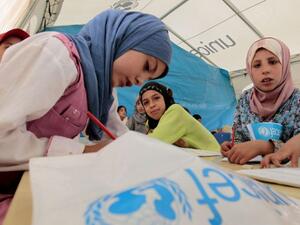 Young Syrian refugees attend a UNICEF-run school at the al-Zaatari refugee camp in the Jordanian city of Mafraq. (AFP/ Khalil Mazraawi)