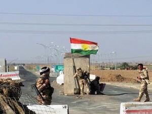 Kurdish forces guard a checkpoint between Kirkuk and Tikrit. Image used for illustrative purposes. (AFP/File)