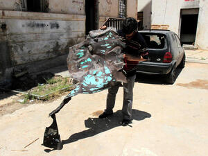 A Libyan man inpects one of the two police stations that were attacked on May 10, 2013 in the eastern Libyan city of Benghazi. Bomb attacks targeted two police stations in Benghazi causing extensive material damage but no casualties, a security official said. (Abdullah Doha/ AFP)