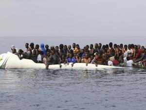  Migrants wait to be rescued from a sinking dinghy off the Libyan coast  (AFP/File Photo)	