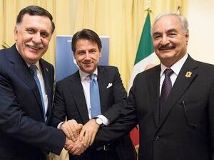 Italian PM Giuseppe Conte (C) posing with head of Libya's GNA Fayez Al- Sarraj (L) and commander of LNA Khalifa Haftar in Palermo. (AFP)