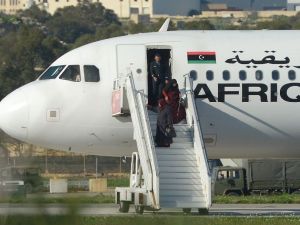 A group of hostages is released from a hijacked Afriqiyah Airways plane in Malta on December 23, 2016. (AFP/Matthew Mirabelli)