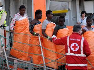 Women disembark from the Siem Pilot on October 24, 2016 after rescue operations of migrants at see during the weekend. (AFP/Stringer)