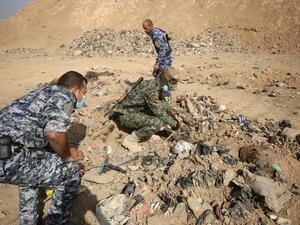 Iraqi soldiers check a mass grave they discovered in the Hamam al-Alil area on November 7, 2016, after they recaptured the area from Islamic State of Iraq. (AFP/File)