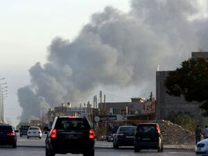 Smoke billows from an area near Tripoli's international airport. (AFP Photo/Mahmud Turkia)