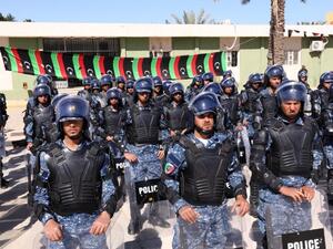 Members of the Libyan judicial police pose after a graduation ceremony. (AFP/Mahmud Turkia)