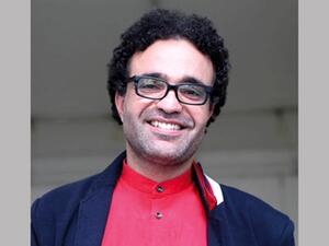 الروائي والناقد التونسي كمال الرياحي