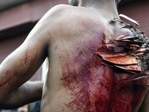 A Kashmiri Shiite Muslim mourner flagellates himself during a religious procession held on the seventh day of Ashura which remembers the slaying of the Prophet Muhammed's grandson in southern Iraq in the seventh century, in Srinagar on September 18, 2018. TAUSEEF MUSTAFA / AFP