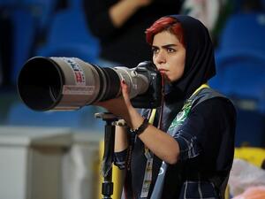 In an act of defiance, Parisa Pourtaherian covered a men football match but from a terrace of a building located near the stadium. (Parisa Pourtaherian/Instagram)