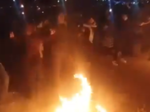 Iranians dancing around fire during the Nowruz celebrating the Persian New Year. (Screenshot)