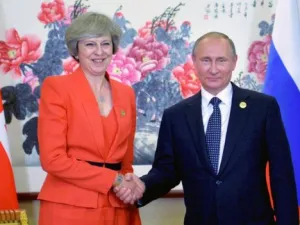 Russian President Vladimir Putin (R) meets with Britain's Prime Minister Theresa May. (AFP)