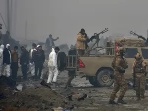 Afghan security forces and investigators gather at the site of a suicide bomb attack outside a British security firm's compound in Kabul, a day after the blast on November 29, 2018. (NOORULLAH SHIRZADA / AFP)