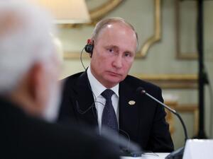 Russia's President Vladimir Putin (L) is pictured during a meeting with India's Prime Minister Narendra Modi (R) and China's President Xi Jinping (out of frame), in the sidelines of the G20 Summit in Buenos Aires. (AFP)