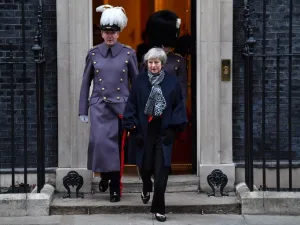 British Prime Minister Theresa May leaves Downing street to take part in a reception for Japan's Prime Minister Shinzo Abe in central London on January 10, 2019. (AFP)
