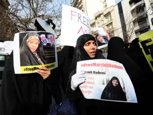 Iranians hold banners bearing messages that call for the release of US-born journalist Marzieh Hashemi, in front of the Swiss embassy in the capital Tehran on January 20, 2019. (AFP/ File)