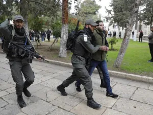 Israeli policemen detain a Palestinian demonstrator during clashes, after protesters tried to break the lock on a gate at the Al Aqsa mosque. (AFP/ File)