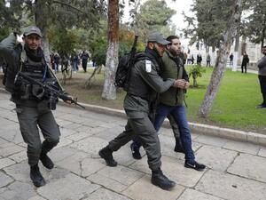 Israeli policemen detain a Palestinian demonstrator during clashes, after protesters tried to break the lock on a gate at the Al Aqsa mosque. (AFP/ File)
