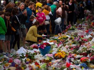 People pay their respects at a memorial site at the Botanical garden in Christchurch on March 18, 2019, three days after a shooting incident at two mosques. (AFP/ File)
