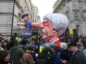 A puppet head of Britain's Prime Minister Theresa May spearing a representation of the British Economy is positioned on Whitehall outside Downing Street. (AFP/ File)
