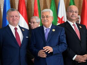 (L to R) Jordan's King Abdullah II, Palestinian president Mahmoud Abbas, and Iraqi President Barham Saleh pose together for the group family photo with other Arab leaders. (AFP/ File) (L to R) Jordan's King Abdullah II, Palestinian president Mahmoud Abbas, and Iraqi President Barham Saleh pose together for the group family photo with other Arab leaders. (AFP/ File)