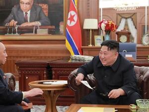 North Korean leader Kim Jong-un (R) talking with Kim Yong-chol, his right-hand man. (AFP/ File)