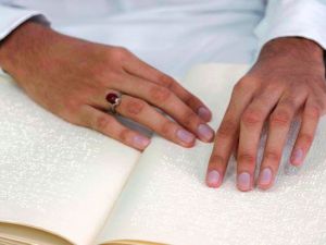 A blind Saudi reads in braille a copy of the Quran, Islam's holy book, inside a mosque on the first day of the holy fasting month of Ramadan. (AFP)