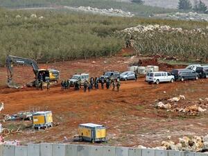 A position near the southern Lebanese village of Kfar Kila shows members of the Israeli military, excavators, trailers and other vehicles operating across on the other side of the border. (AFP)