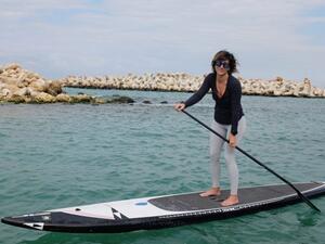 Caroline Raphael trains for her SUP challenge in Jounieh, Tuesday, Feb. 12, 2019. (The Daily Star/Finbar Anderson)