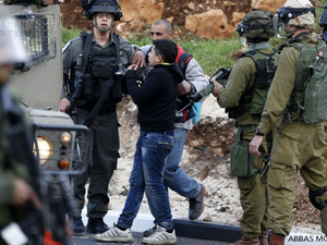 Israeli forces detain a Palestinian youth during clashes near Israel's Ofer prison. (AFP/File)