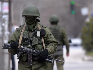 Russian soldiers patrol outside the navy headquarters in Simferopol. (AFP/ File Photo)