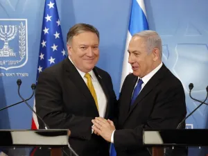 U.S. Secretary of State Mike Pompeo. left. is greeted by Israeli Prime Minister Benjamin Netanyahu. (AFP/File)