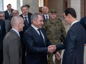 Syrian President Bashar al-Assad greeting the visiting Russian defence minister, Sergei Shoigu, in Damascus on March 19, 2019. (AFP /STRINGER)
