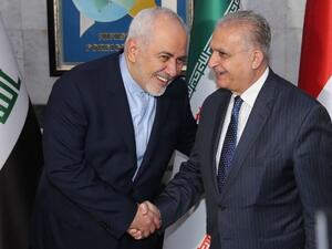 Iraqi Foreign Minister Mohammad Ali al-Hakim (R) receives his Iranian counterpart, Mohammad Javad Zarif, in Baghdad on January 13, 2019 (AFP Photo/SABAH ARAR)