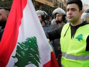 A Lebanese protester wears a yellow vest, inspired by France's Gilet Jaunes, during an anti-corruption demonstration in Beirut on December 23, 2018. (AFP/ File)