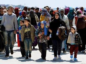 A group of refugees arriving in Italy in 2015. (AFP/File) A group of refugees arriving in Italy in 2015. (AFP/File)