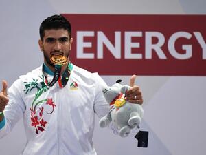 Iran's Mohsen Mohammadseifi poses with his gold medal at the men's sanda 70kg wushu medal ceremony of the 2018 Asian Games in Jakarta on August 23, 2018.
Juni Kriswanto / AFP