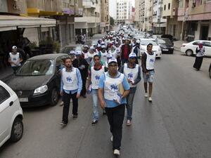 Supporters of Morocco's Party of Authenticity and Modernity take to the streets of Rabat to pass out campaign leaflets on October 5, 2016. (AFP/Fadal Senna)