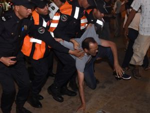 Security forces seize a demonstrator in Rabat on June 20, 2017 during a protest in support of the grassroots movement for the neglected Rif region. The Rif has long had a tense relationship with the central authorities in Rabat, and it was at the heart of the Arab Spring-inspired protests in Morocco in February 2011.(Fadel Senna/AFP)