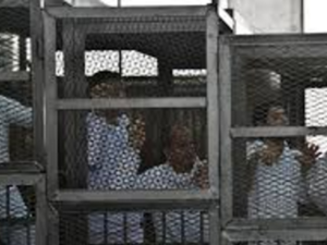 Muslim Brotherhood members await trial. (AFP/Khaled Desouki)