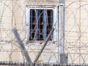 A glimpse past the fence of Nafha prison. (AFP/File)