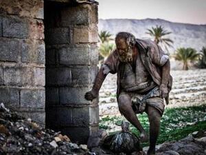 Amou Haji seen headed into one of his makeshift homes. [IRNA]