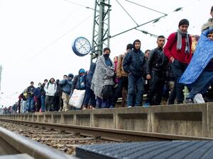 Migrants make their way to board a train to Duesseldorf, Germany in Passau. (AFP/File)