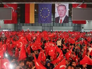 Supporters of Turkish President Recep Tayyip Erdogan wave Turkish flags. (AFP/File)