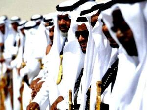 A row of sword-wielding Saudi men in the sun. (AFP/File)