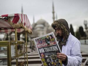 A headline in German reads 'We mourn" in a Turkish newspaper the day after the Istanbul attack. (AFP/Bulent Kilic)