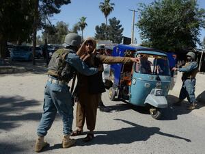 Afghan police search vehicles in Jalalabad, on April 29, 2016. (AFP/File)