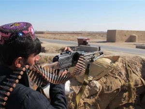 An Afghan Local Police (ALP) personnel keeps watch during an ongoing battle with Taliban militants. (AFP/File)