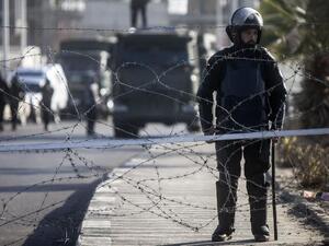Illustrative photo of Egyptian riot police stand guard in Cairo, January 28, 2014. (AFP/File)