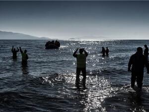 A boat carrying refugees and migrants arrives on a Greek island, after crossing the Aegean sea from Turkey in February. (AFP/Aris Messinis) A boat carrying refugees and migrants arrives on a Greek island, after crossing the Aegean sea from Turkey in February. (AFP/Aris Messinis)